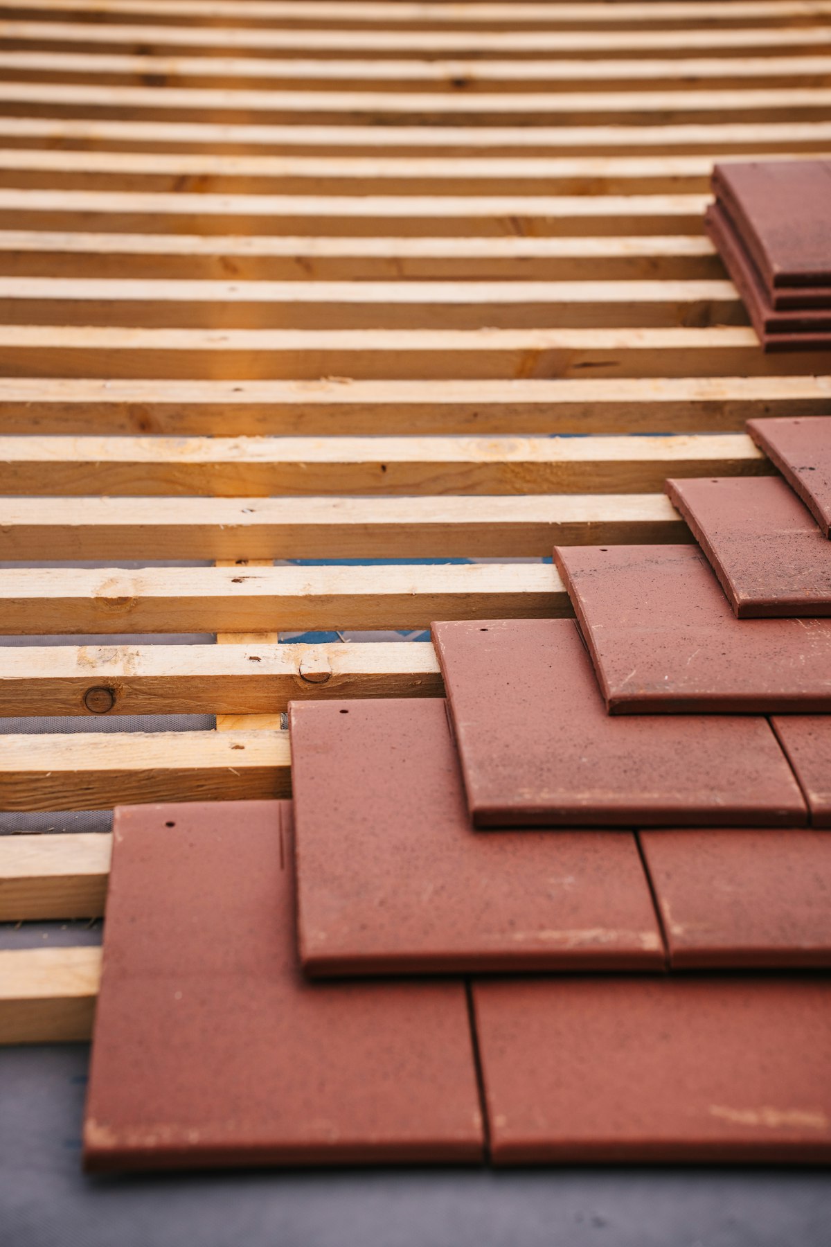 Roof tiles being installed on timber structure